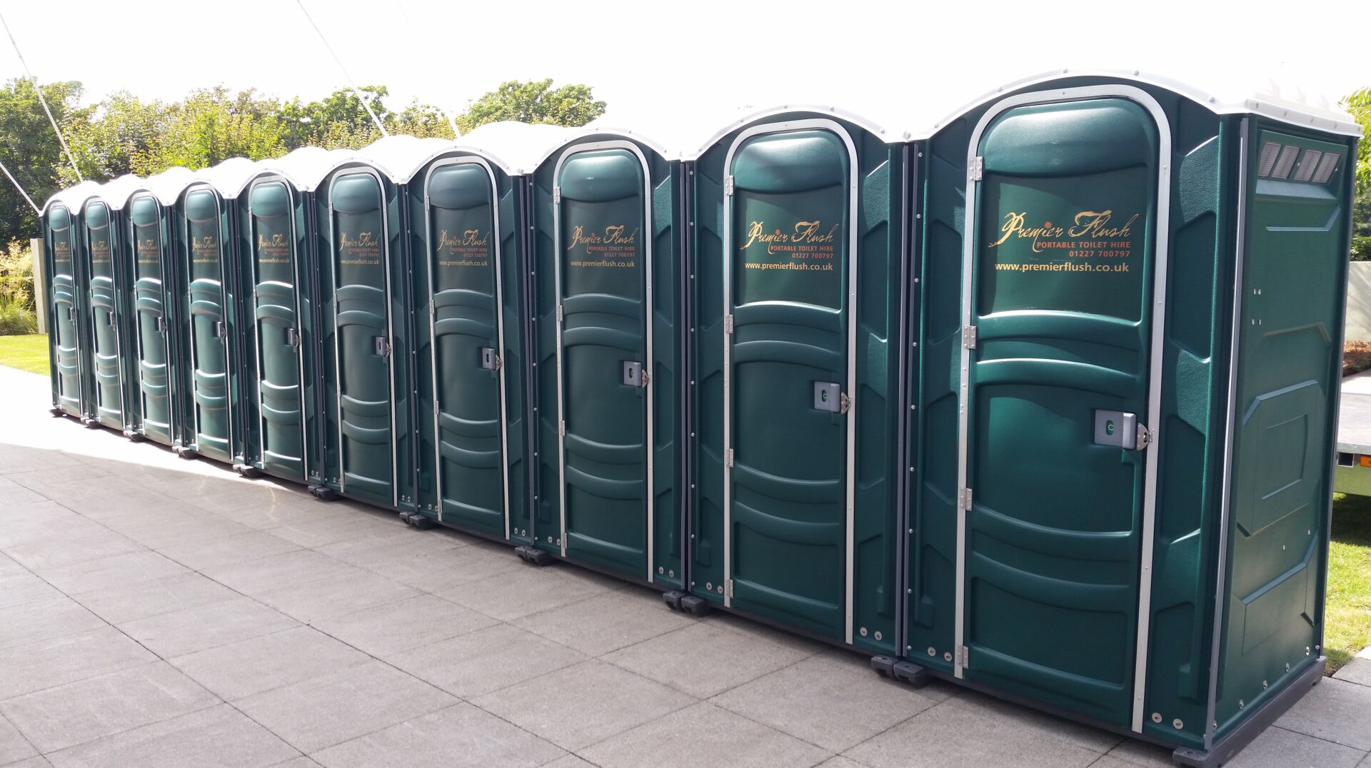 Mobile toilets at outdoor wedding venue